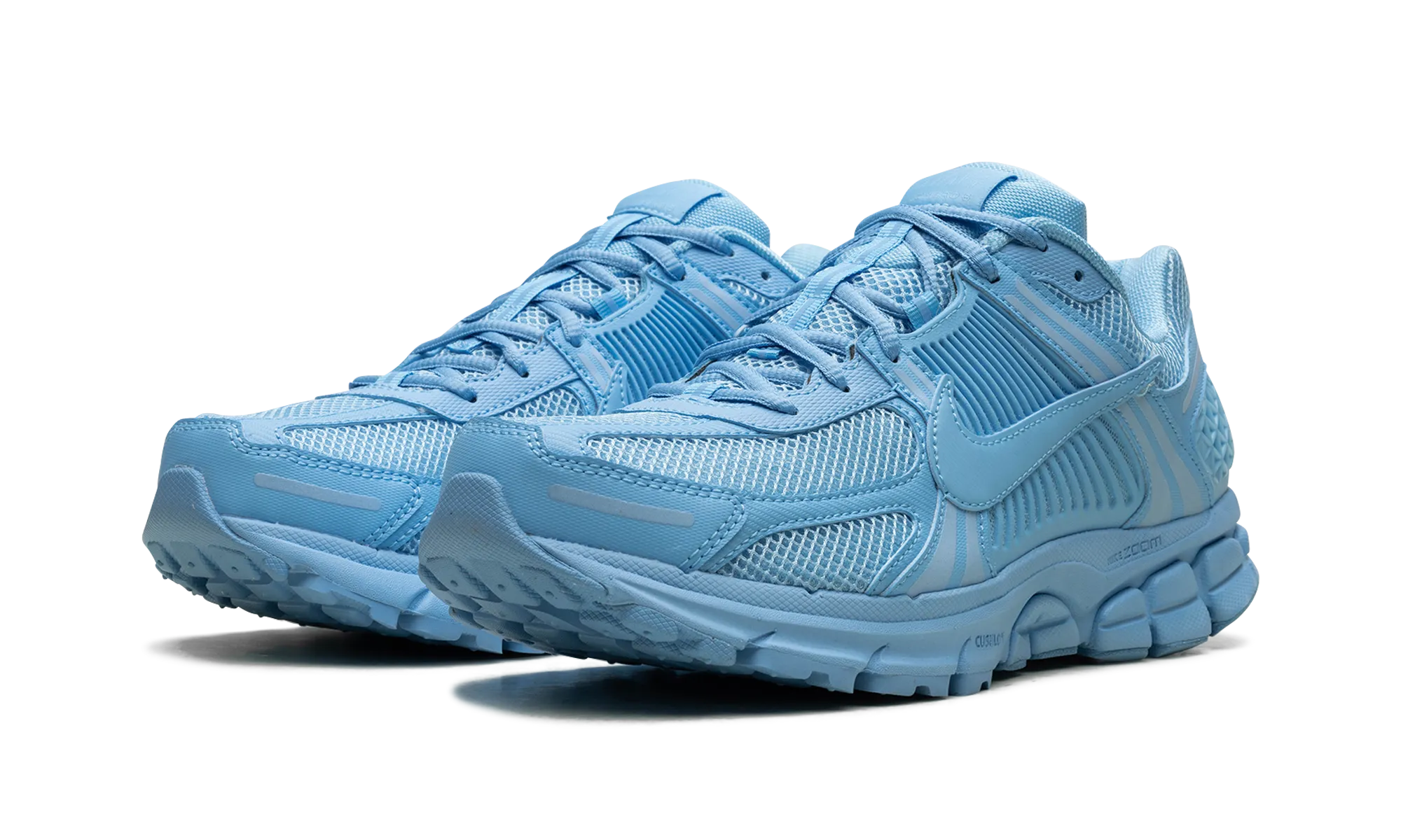 Zoom Vomero 5 "University Blue" running in stadium tracks shoes