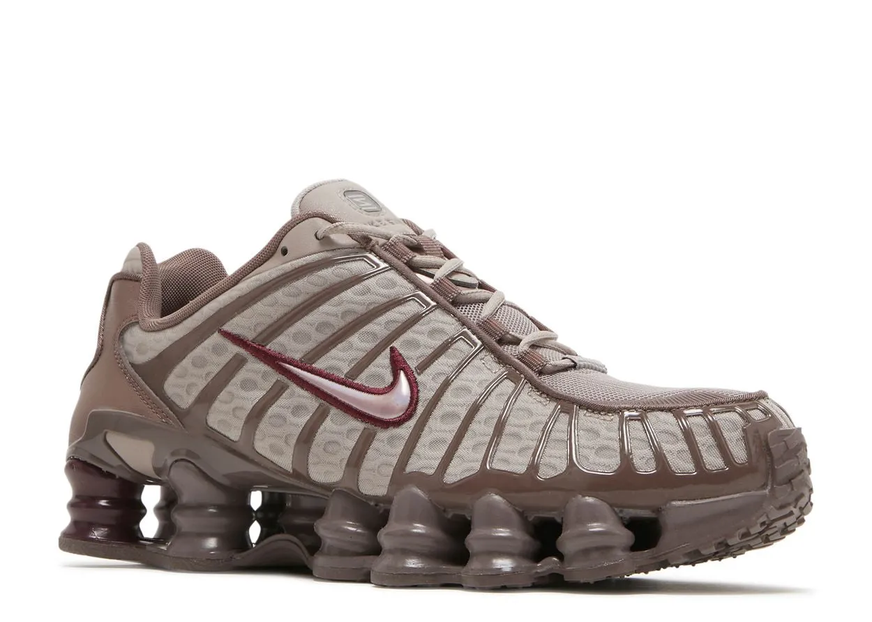 running in a boardwalk area shoes Nike Shox TL Pumice Night Maroon