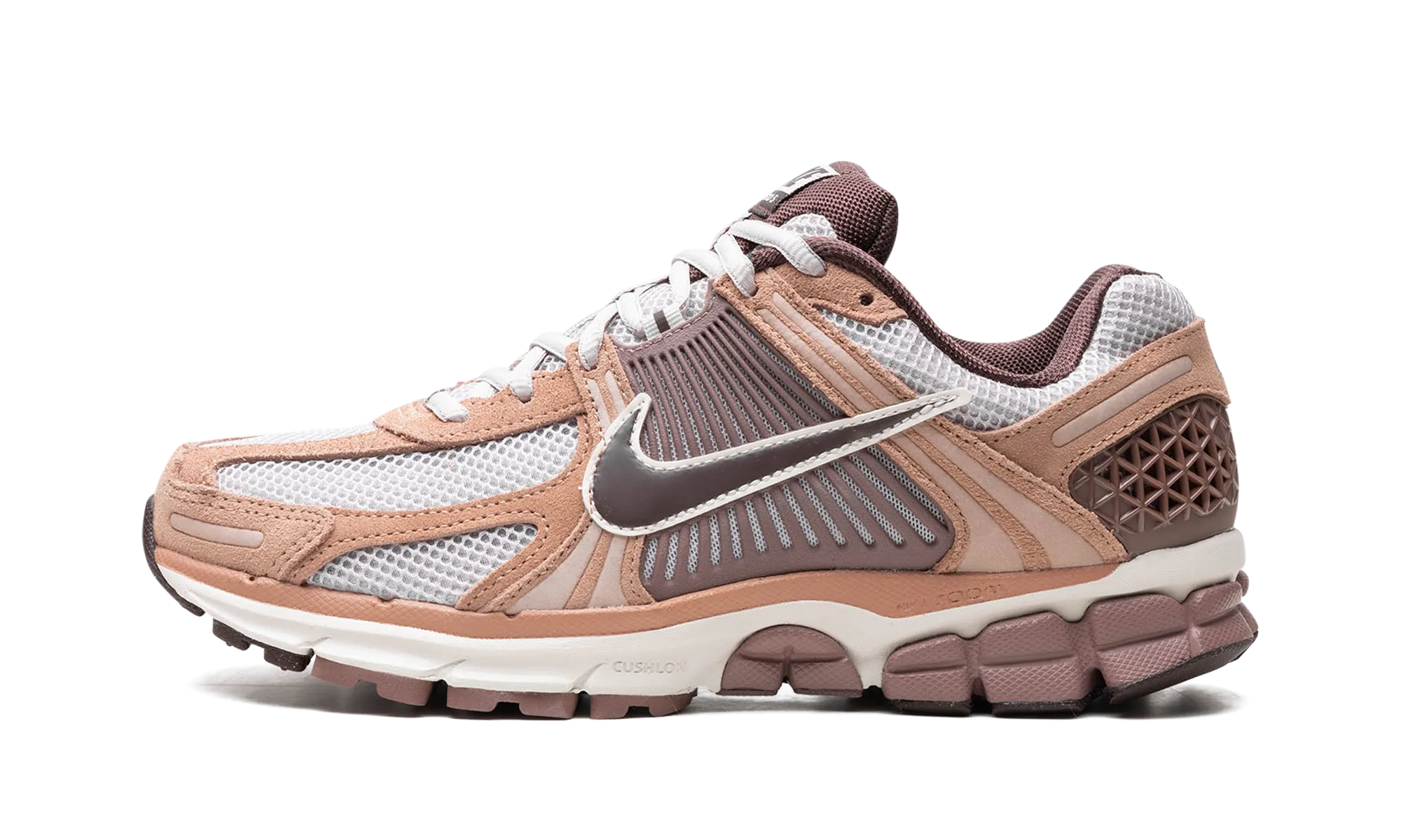 Zoom Vomero 5 "Dusted Clay" running in a subway station area shoes