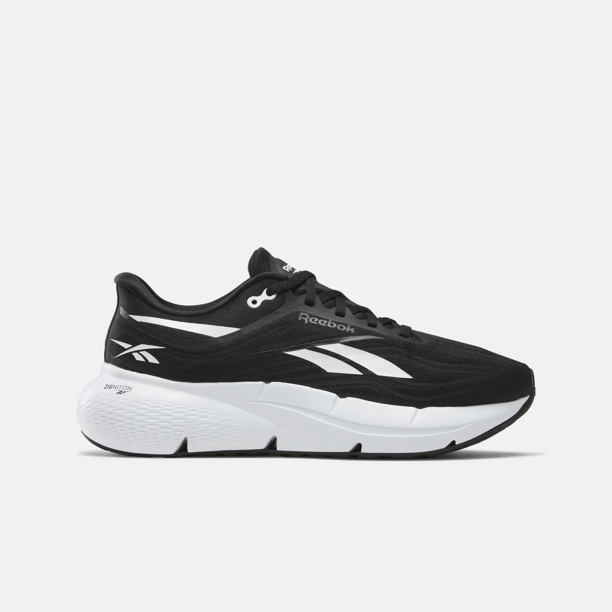 Men's Zignition Running Shoes running in a cable car area shoes